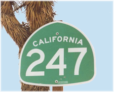 Hwy 247 sign and joshua tree